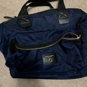 Brand new Marc Jacobs baby bag. Never used. Navy blue & black with gold detail.